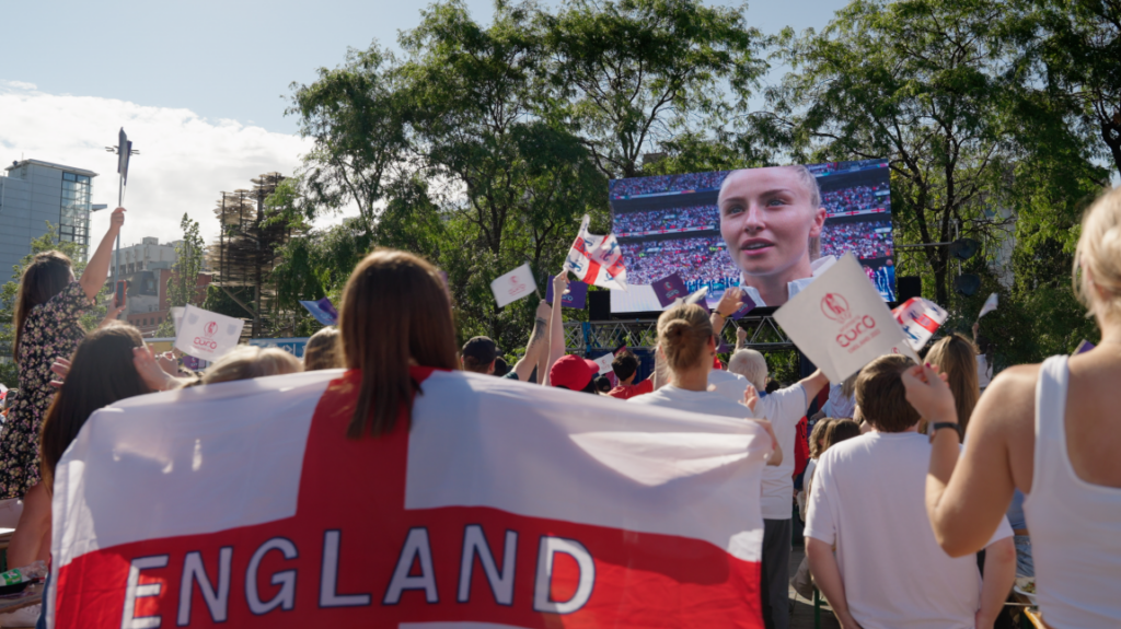 A group watching the ladies national team