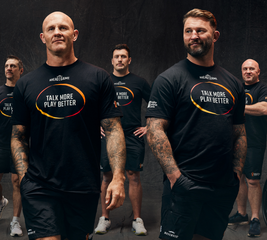 A group of people wearing a t shirt advertising the company.