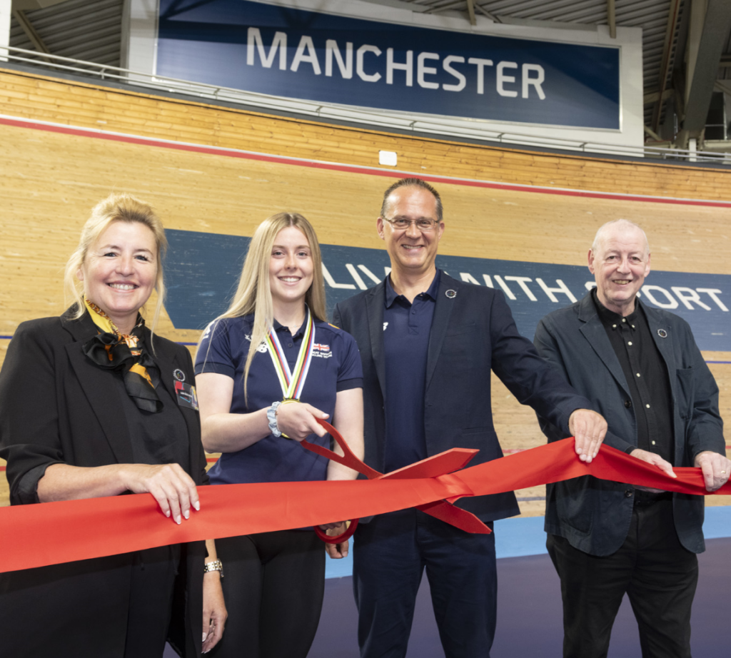 Cutting a ribbon to announce an opening