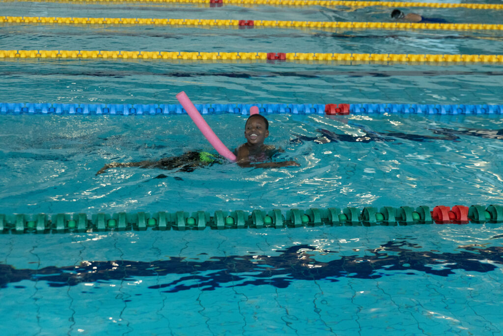Boy in pool swimming