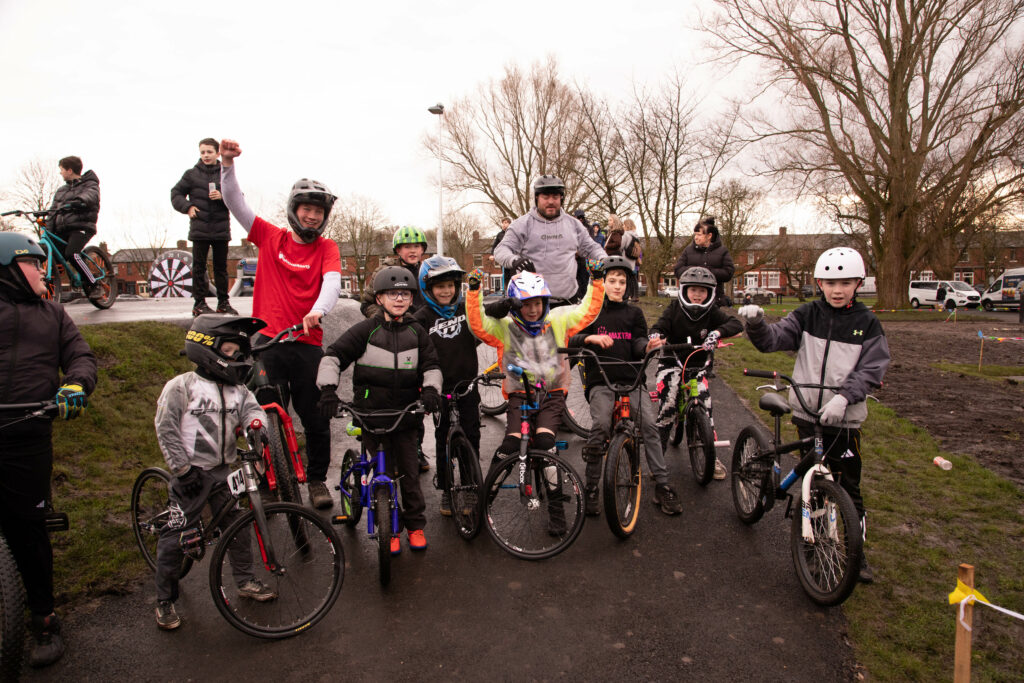 Group of kids and cycling instructors on BMX's