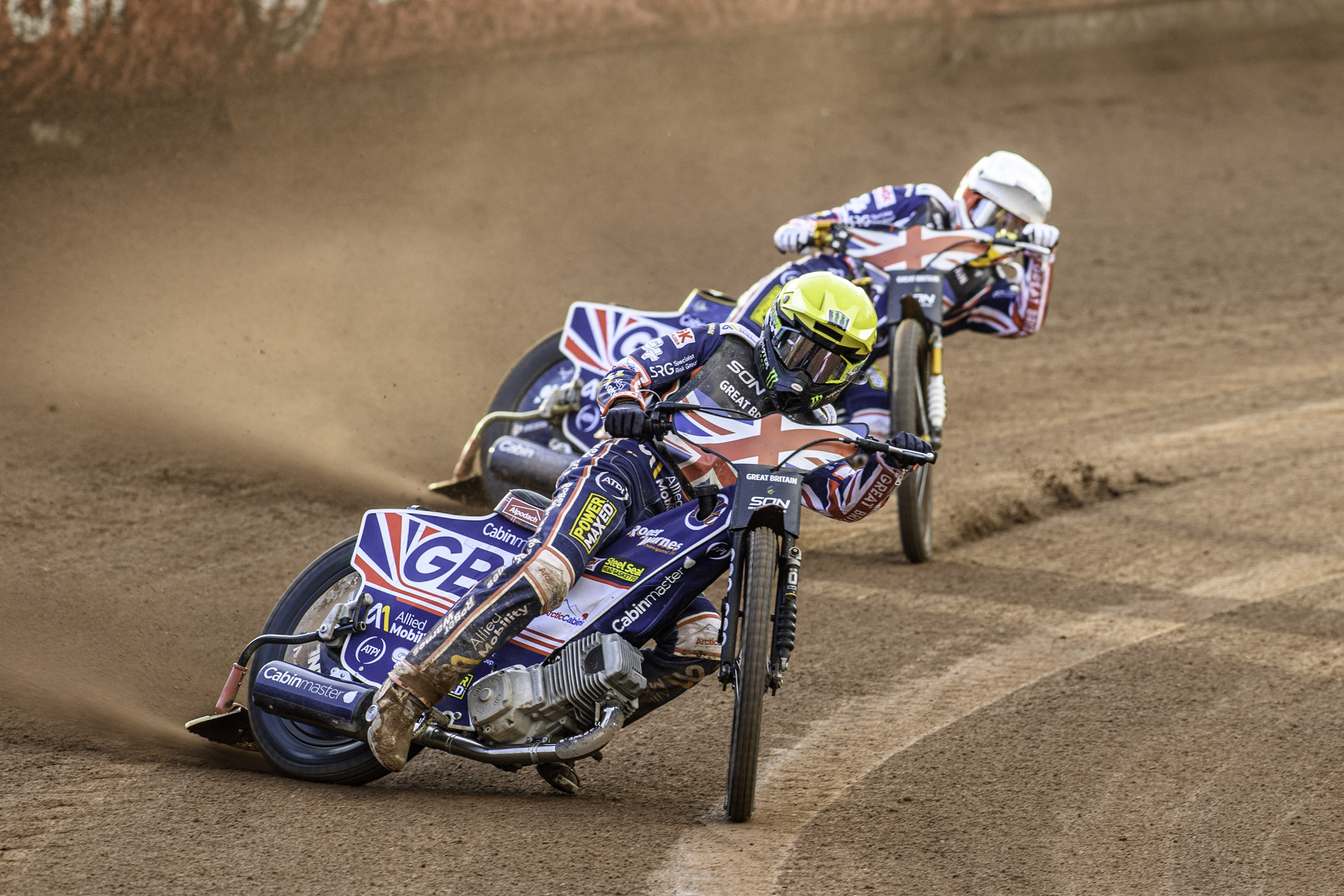 Dan Bewley of Great Britain in Yellow leading team mate Robert Lambert during the Monster Energy FIM Speedway of Nation Final at the National Speedway Stadium, Manchester on Saturday 13th July 2024.
