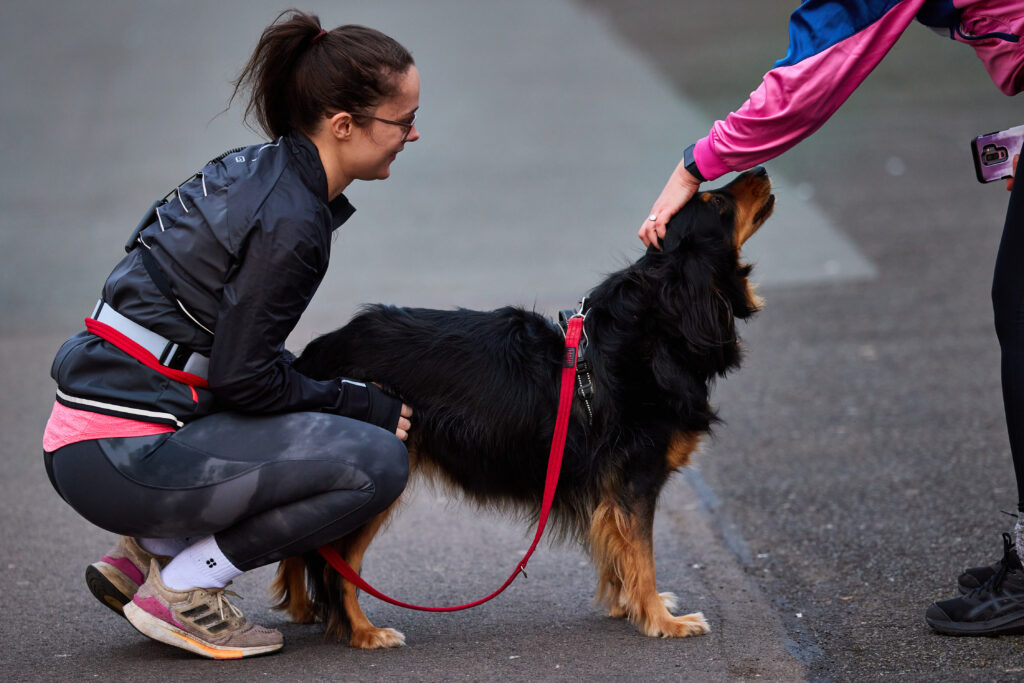 Woman with dog in running gear