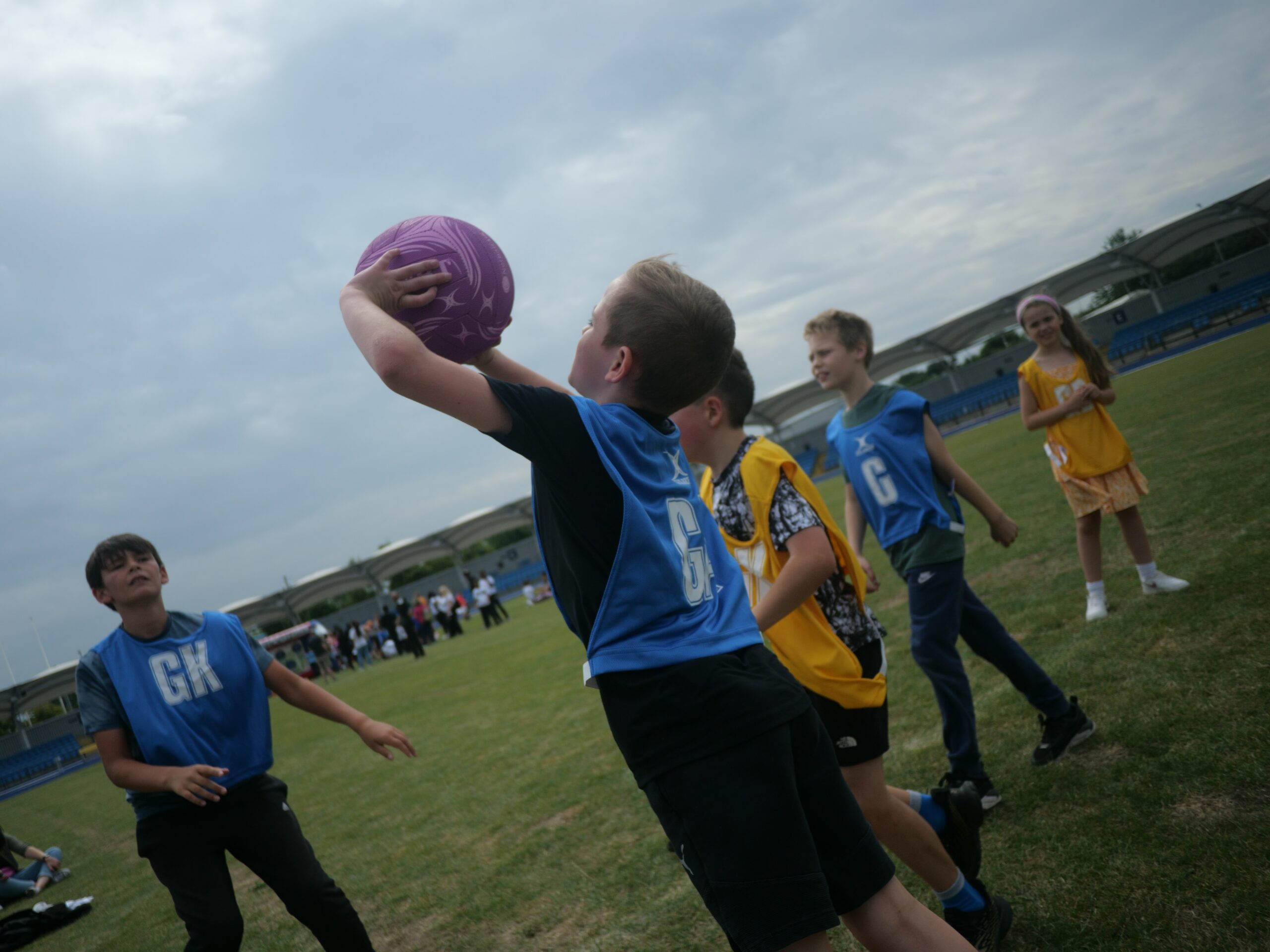 Kids playing netball outdoors