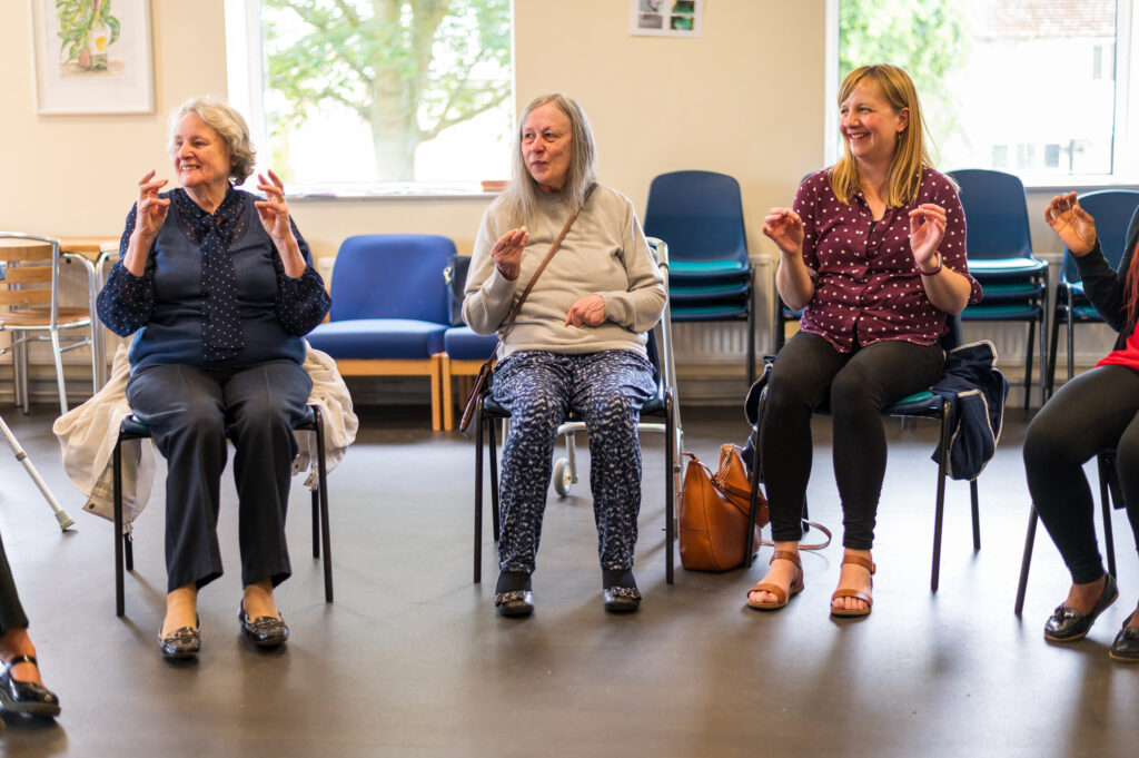 Group of older women chair based exercise