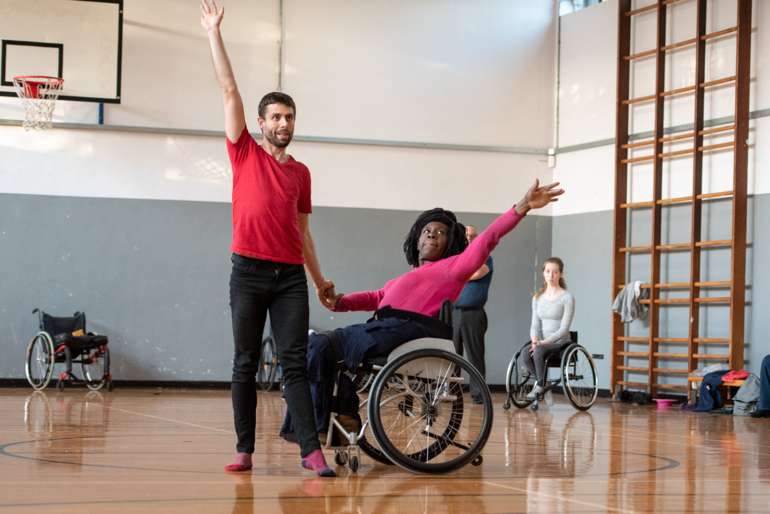 Woman in wheelchair with dance instructor at Dance Class