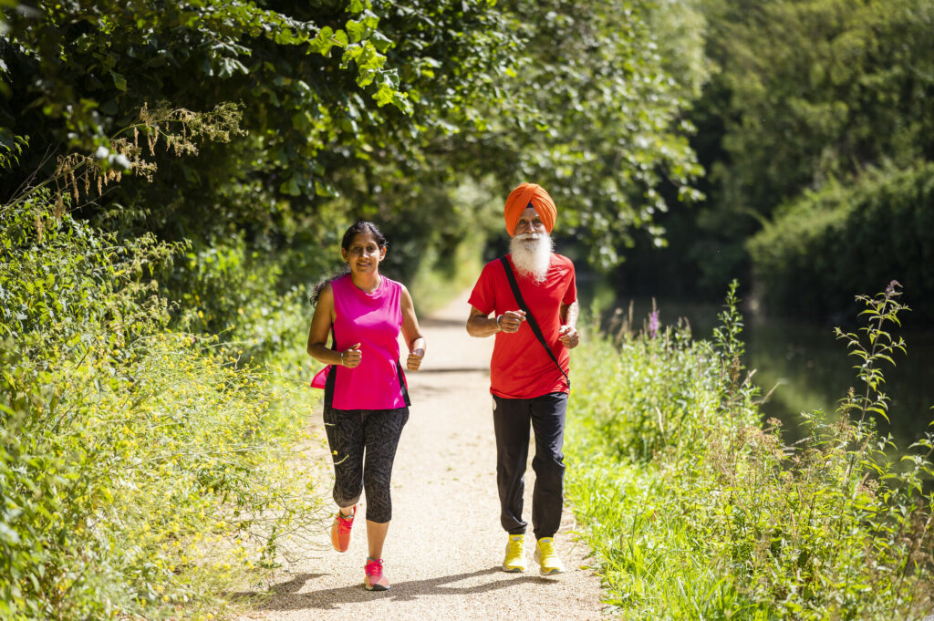 Man and Woman running in park