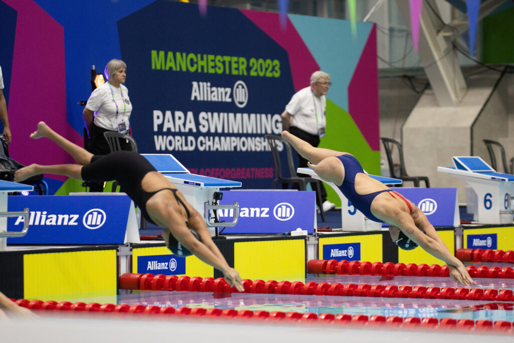 Swimmers diving in pool at World Para Swimming Championships
