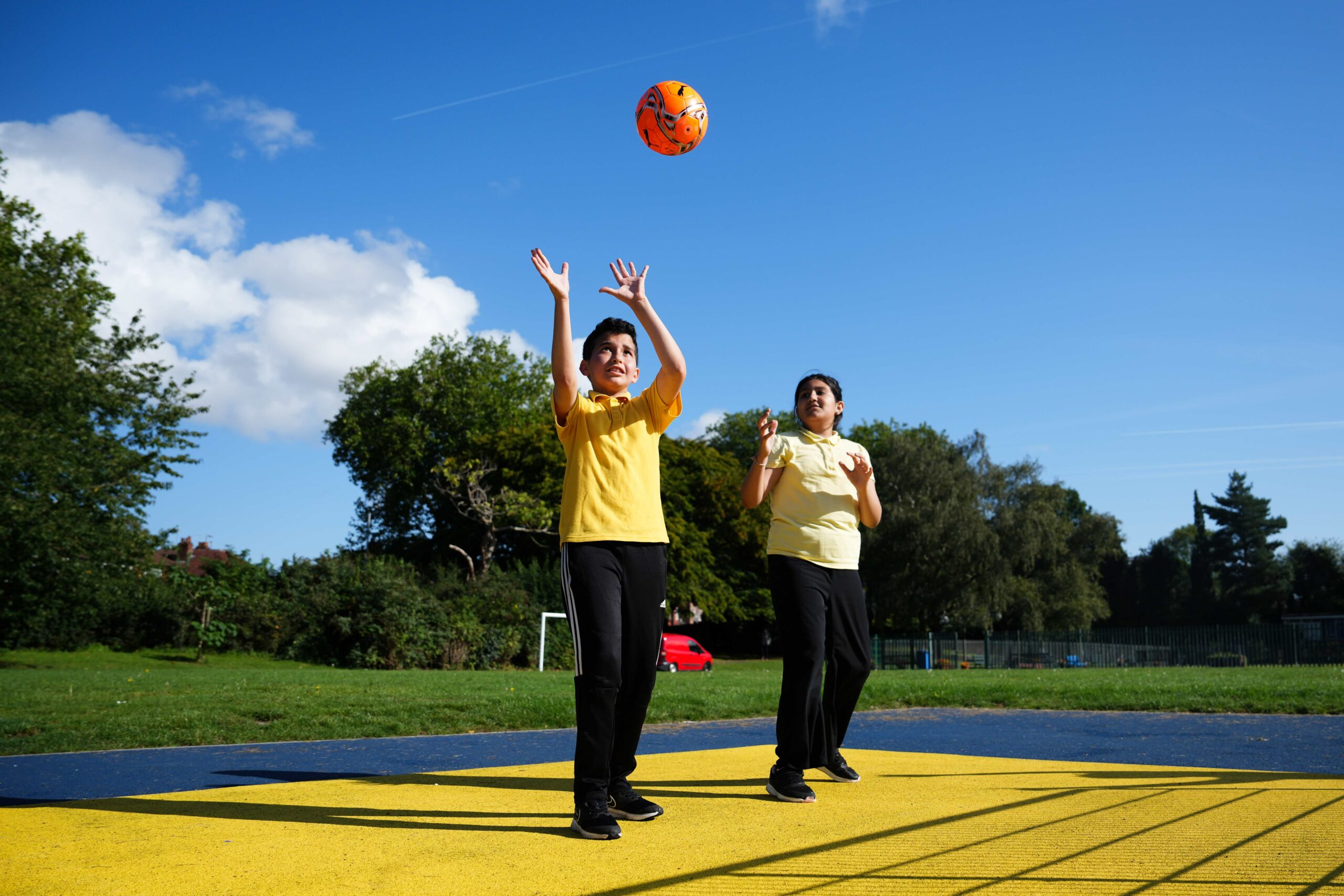 Children playing with a ball in a Manchester PlayZone